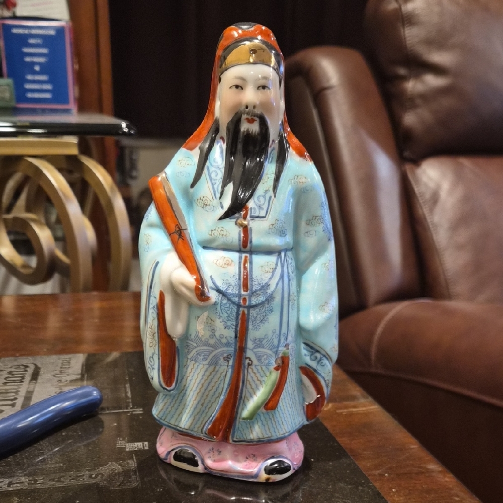 Elegant Porcelain Figurine in Blue and Orange